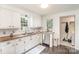 Modern kitchen with white cabinets, butcher block countertops, and stainless steel appliances at 630 S Myrtle School Rd, Gastonia, NC 28052