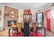 Spacious dining room with a large wooden table and brick fireplace at 510 S Carolina Ave, Spencer, NC 28159