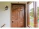 Brown exterior door with a keypad lock and a large window offering natural light at 525 12Th Sw St # 26, Hickory, NC 28602