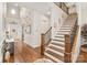 Bright and spacious entryway with hardwood floors and elegant staircase at 204 Wesley Manor Dr, Matthews, NC 28104