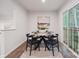 Cozy dining area with a round table and four chairs, near sliding door at 5008 Winding Jordan Ln, Charlotte, NC 28269