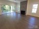 Living room with fireplace, hardwood floors, and access to a deck at 444 19Th Avenue Nw Cir, Hickory, NC 28601