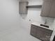 Laundry room with gray cabinets and a quartz countertop at 444 19Th Avenue Nw Cir, Hickory, NC 28601