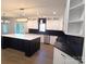 Modern kitchen with white and black cabinetry, large island, and quartz countertops at 444 19Th Avenue Nw Cir, Hickory, NC 28601