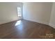 Bright bedroom with hardwood floors and a large window at 444 19Th Avenue Nw Cir, Hickory, NC 28601