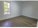 Bright bedroom with hardwood floors and a window offering natural light at 444 19Th Avenue Nw Cir, Hickory, NC 28601