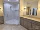 Bathroom with walk-in shower, modern vanity, and mosaic tile floor at 444 19Th Avenue Nw Cir, Hickory, NC 28601