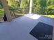 Covered porch with black railing and grey flooring at 444 19Th Avenue Nw Cir, Hickory, NC 28601