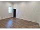 Bonus room with hardwood floors and an accent wall at 444 19Th Avenue Nw Cir, Hickory, NC 28601