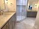Stylish bathroom with a double vanity, corner shower, and updated flooring at 444 19Th Avenue Nw Cir, Hickory, NC 28601