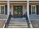 Double front doors with sidelights and black railings at 444 19Th Avenue Nw Cir, Hickory, NC 28601