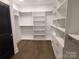 Large walk-in closet with custom shelving and hanging rods at 444 19Th Avenue Nw Cir, Hickory, NC 28601