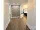 Modern entry hall showcasing a geometric accent wall and hardwood floors at 444 19Th Avenue Nw Cir, Hickory, NC 28601