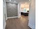 Elegant entry hall with geometric accent wall and view into kitchen at 444 19Th Avenue Nw Cir, Hickory, NC 28601