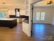 Modern kitchen with island, stainless steel appliances, and dark cabinetry at 444 19Th Avenue Nw Cir, Hickory, NC 28601