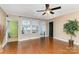 Living room with hardwood floors and access to sunroom at 601 Hasty St, Marshville, NC 28103