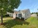 House with a white garage door and small yard at 851 Littleton Dr, Concord, NC 28025