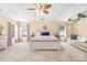 Large main bedroom with plush carpeting and a sitting area at 114 Silverspring Pl, Mooresville, NC 28117