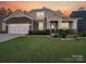 Two-story house with stone accents and a landscaped lawn at 2716 Manor Stone Way, Indian Trail, NC 28079