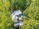 Brick home surrounded by lush trees, viewed from above at 10250 Barringer Ct, Mount Pleasant, NC 28124