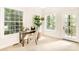 Bright home office with built-in desk and access to a deck overlooking the woods at 10250 Barringer Ct, Mount Pleasant, NC 28124