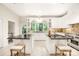 Spacious kitchen with double islands, white cabinets, and granite countertops at 10250 Barringer Ct, Mount Pleasant, NC 28124