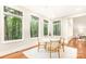 Charming breakfast nook with a round table and four chairs, overlooking the woods at 10250 Barringer Ct, Mount Pleasant, NC 28124