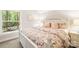 Lovely bedroom with a floral comforter and a large window at 10250 Barringer Ct, Mount Pleasant, NC 28124