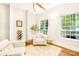 Bright sitting room with hardwood floors and large windows at 10250 Barringer Ct, Mount Pleasant, NC 28124