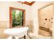 Spa-like bathroom with soaking tub and walk-in shower at 10250 Barringer Ct, Mount Pleasant, NC 28124