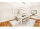 Elegant dining room with hardwood floors and large chandelier at 10250 Barringer Ct, Mount Pleasant, NC 28124