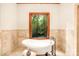Relaxing bathroom with soaking tub and wood window at 10250 Barringer Ct, Mount Pleasant, NC 28124