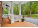 Spacious front porch with white columns and wood flooring at 10250 Barringer Ct, Mount Pleasant, NC 28124