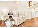 Living room with fireplace, hardwood floors, and large windows at 10250 Barringer Ct, Mount Pleasant, NC 28124