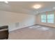 Spacious bonus room with two windows and carpeted floor at 2716 Manor Stone Way, Indian Trail, NC 28079