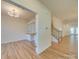 Home office with built-in shelving and hardwood floors, near staircase at 2716 Manor Stone Way, Indian Trail, NC 28079