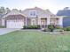 Two-story house with stone accents and landscaping at 2716 Manor Stone Way, Indian Trail, NC 28079