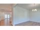 Simple dining room with hardwood floors and a chandelier at 2716 Manor Stone Way, Indian Trail, NC 28079