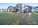 House with a large backyard and covered patio at 2716 Manor Stone Way, Indian Trail, NC 28079