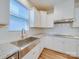 Modern kitchen with white cabinets and granite countertops at 2716 Manor Stone Way, Indian Trail, NC 28079