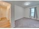 Bedroom with carpet and access to hallway at 2716 Manor Stone Way, Indian Trail, NC 28079