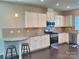 Modern kitchen featuring granite countertops and white cabinets at 16835 Cozy Cove Rd, Charlotte, NC 28278