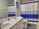 Bathroom with double sinks and shower/tub combo at 16835 Cozy Cove Rd, Charlotte, NC 28278