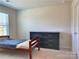 Bedroom with a twin bed and dresser at 16835 Cozy Cove Rd, Charlotte, NC 28278