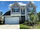 Two story house with gray siding and landscaping at 16835 Cozy Cove Rd, Charlotte, NC 28278