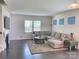 Relaxing living room featuring a large sectional sofa and a fireplace at 16835 Cozy Cove Rd, Charlotte, NC 28278