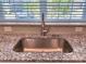 Modern kitchen sink with a stainless steel basin and granite countertop at 16835 Cozy Cove Rd, Charlotte, NC 28278