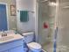 Clean bathroom with shower stall, toilet and vanity at 16835 Cozy Cove Rd, Charlotte, NC 28278