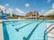 Lap pool with water features and adjacent clubhouse at 16835 Cozy Cove Rd, Charlotte, NC 28278