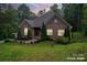 Brick house with landscaping at dusk at 10604 Russet Pl, Charlotte, NC 28227